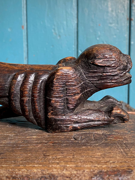 Pair Charming Antique 17th Century Oak Hounds In Recumbent Poses With Naive Grimacing Faces