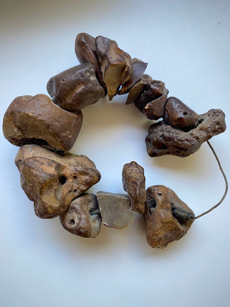 Curious Collection Of Antique Hag Stones Used In Folklore To Ward Off Evil Spirits, Witches & The “Evil Eye” - Source Vintage