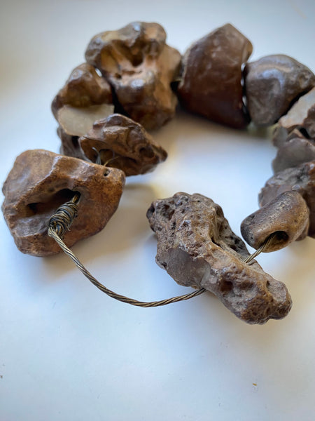 Curious Collection Of Antique Hag Stones Used In Folklore To Ward Off Evil Spirits, Witches & The “Evil Eye” - Source Vintage