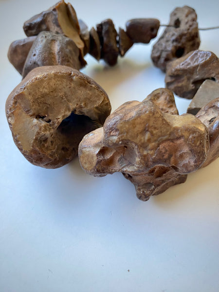 Curious Collection Of Antique Hag Stones Used In Folklore To Ward Off Evil Spirits, Witches & The “Evil Eye” - Source Vintage