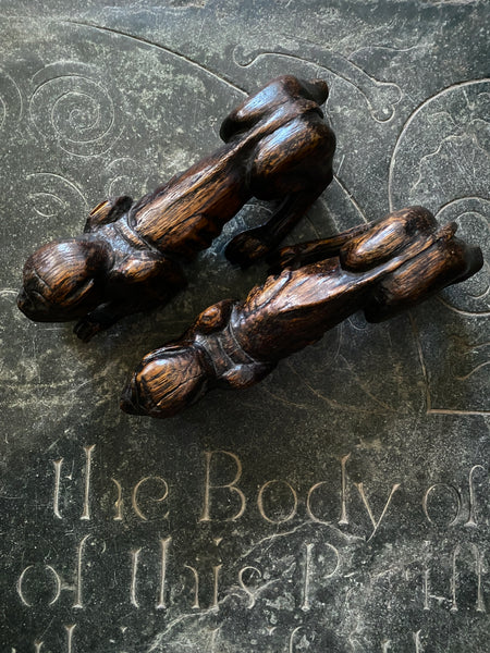 Pair Charming Antique 17th Century Oak Hounds In Recumbent Poses With Naive Grimacing Faces