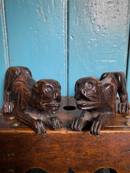 Pair Charming Antique 17th Century Oak Hounds In Recumbent Poses With Naive Grimacing Faces