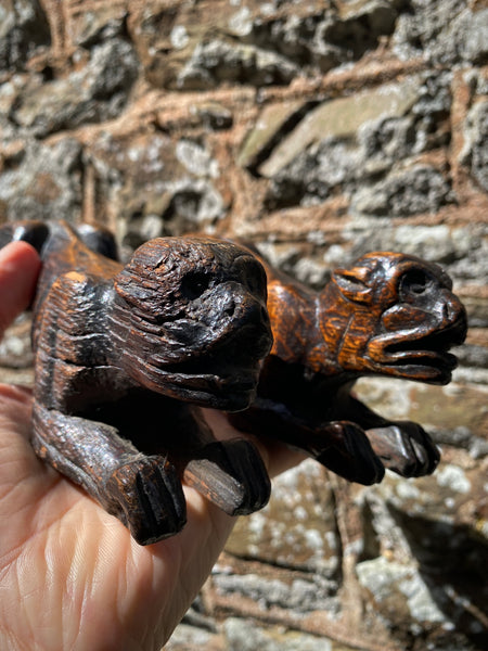 Pair Charming Antique 17th Century Oak Hounds In Recumbent Poses With Naive Grimacing Faces