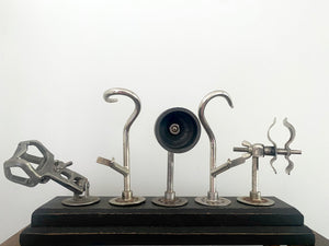 A Selection Of Prosthetic Arm Attachments Mounted On A Wooden Base c.1930’s